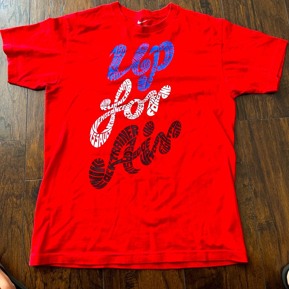 Nike man’s shirtmedium size red with blue,white & black “UP FOR AIR” print